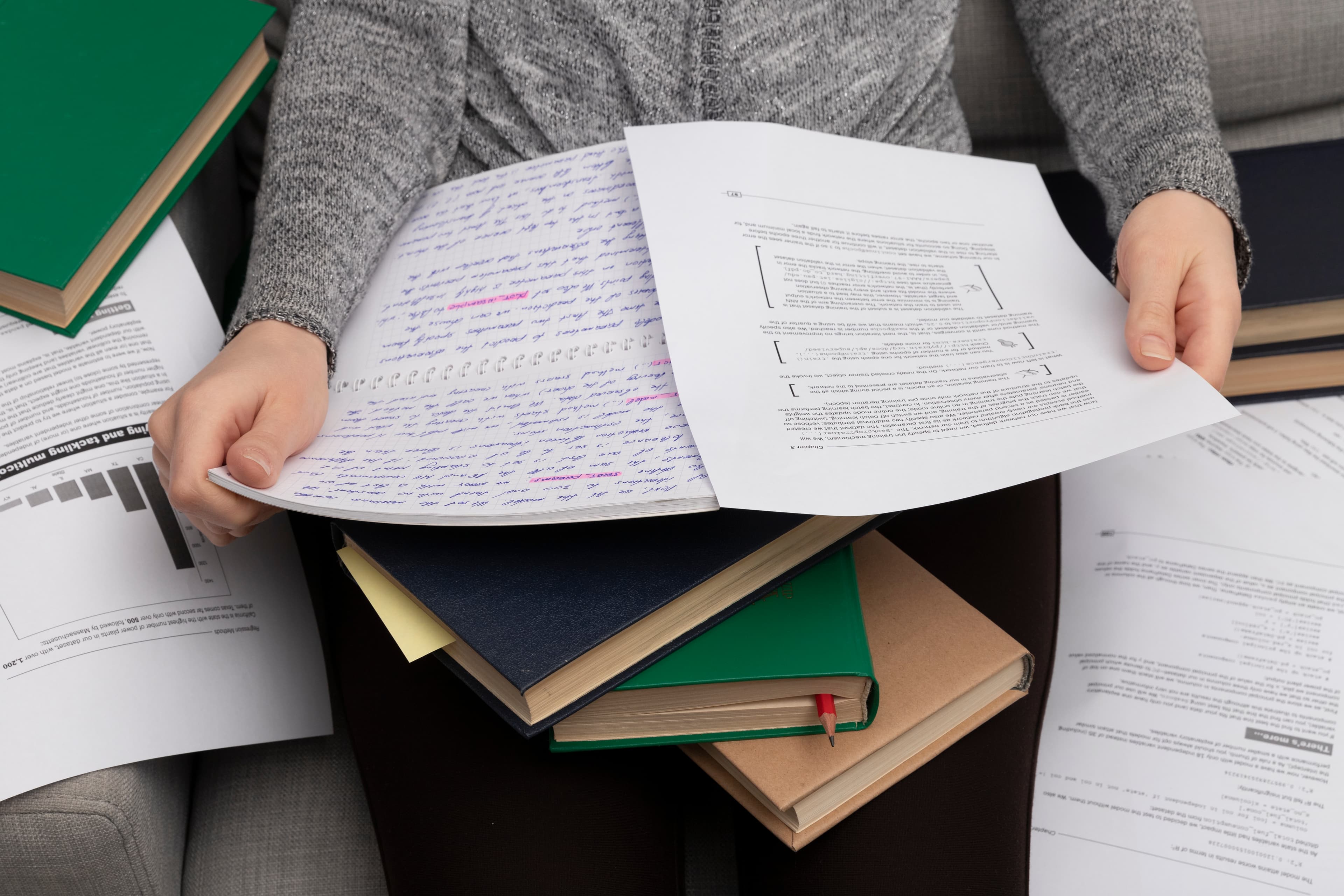 A stack of exam papers waiting to be graded